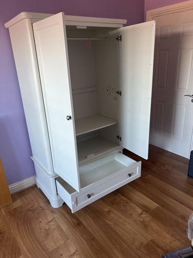 White double door high wardrobe with bottom drawer and shelf