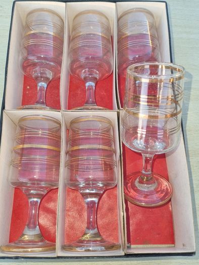 The set features six vintage vodka or liqueur glasses.