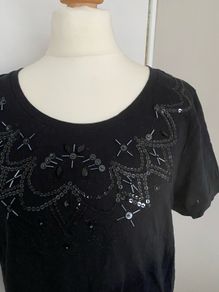 New Black Top with Sequins on neckline, size 12