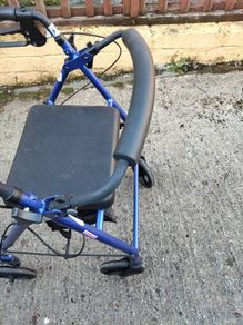 rollator with seat and storage pouch