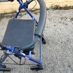 rollator with seat and storage pouch