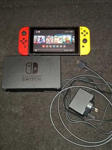 Nintendo Switch + games + 2 joy cons