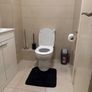 Room with double bed and attached washroom Image 8