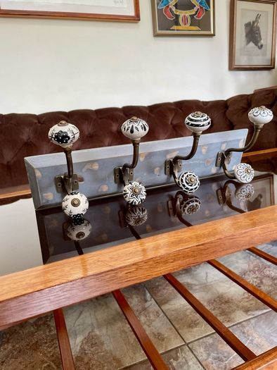 New Unused Stylish Entryway Mounted Ceramic and Brass Coat Hanger