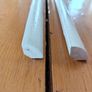 Two 2.4m lengths of white wooden moulding 10x10mm Image 4