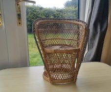 Vintage miniature wicker armchair in the "peacock" style