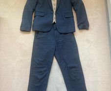 Beautiful boys blue linen suit with shirt and waistcoat