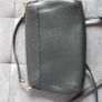 Michael Kors black crossbody bag with adjustable shoulder strap and gold-tone hardware. In great condition, only some colour fading on the logo, as shown in the photos. Image 4