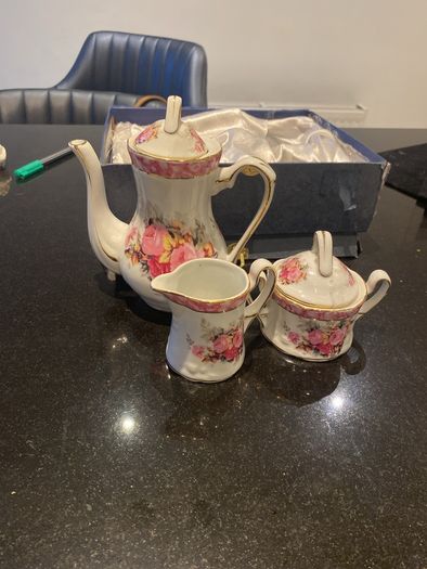 Vintage Porcelain small teapot sugar bowl and creamer set .       porcelain
