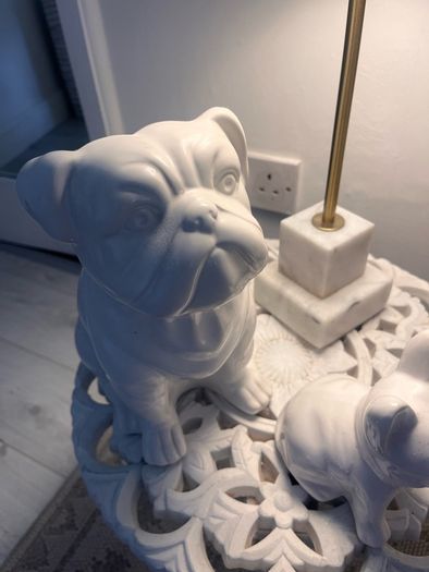 Two ceramic dog ornaments