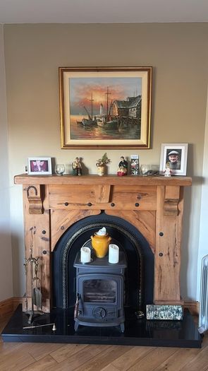 Timber surround with cast iron insert for fireplace