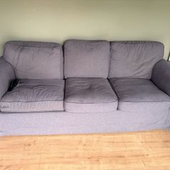 Two IKEA three-seater sofas and armchair