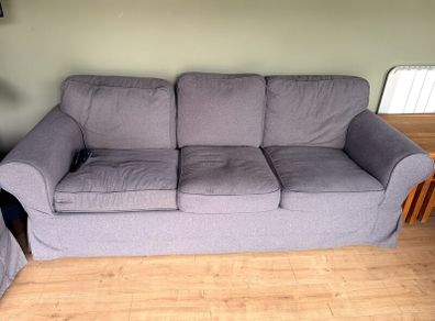 Two IKEA three-seater sofas and armchair