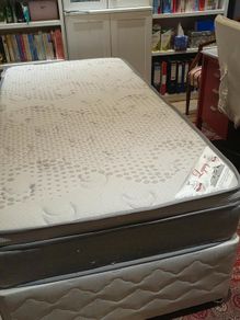Single divan bed with pristine clean mattress and space for headboard