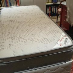Single divan bed with pristine clean mattress and space for headboard