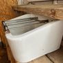 Heavy vintage ceramic basin with a built-in metal rack. Image 3