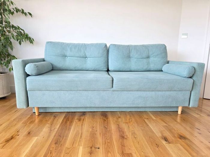 Sofa Bed. Sleeping fuction with Storage container. Comfortable sleep for your guests. High quality materials. Impeccable condition. Decorative pillows included.