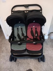 Joie double baby's buggie with rain covers