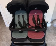 Joie double baby's buggie with rain covers
