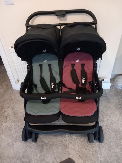 Joie double baby's buggie with rain covers