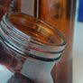 484 - Set of 4 Vintage Brown Amber Glass Screw Top Collectible Decorative Bottles Image 4