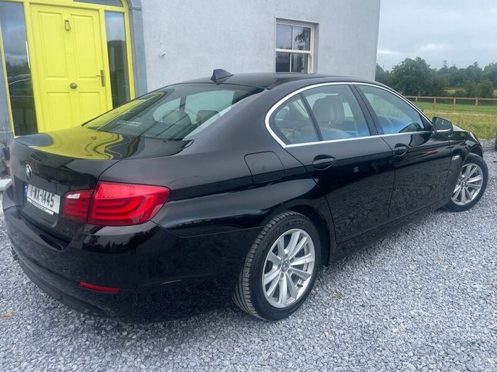 BMW 5 series, black with cream leather interior