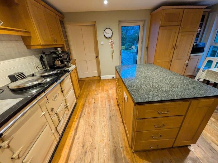 Solid wood kitchen with granite island