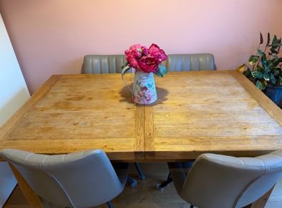 Solid oak dining table and chairs