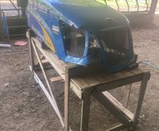 New Holland bonnet T6030 damaged on front corner