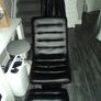 Black leather swivel chair with foot stool Image 6