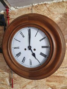 Vintage circular European wooden clock