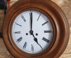 Vintage circular European wooden clock