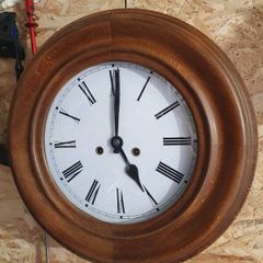 Vintage circular European wooden clock