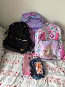 3 school bags and 2 pencil cases