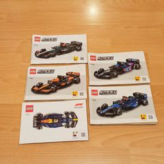 instruction booklets for five different LEGO Speed Champions Formula 1  race car building sets