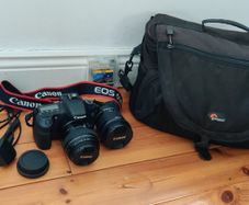 Canon 60d with 10-18 and 85 1.8 lenses, Lowepro bag and lots of extras