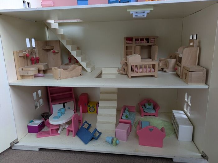 wooden doll house with furniture