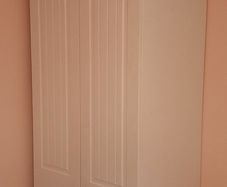 1 white wardrobe, over double bed press
