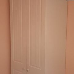 1 white wardrobe, over double bed press
