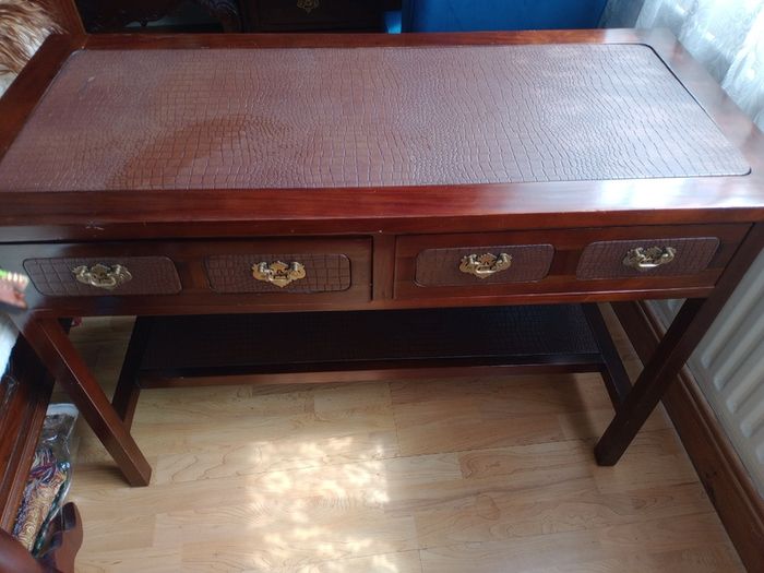 Wooden console table with faux crocodile skin detail