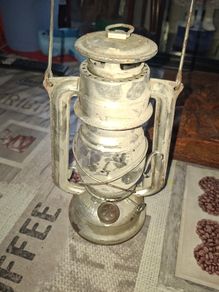 Beautiful Old Hurricane Lantern, Post Available, The lantern features a central glass globe protected by a metal cage, designed to shield the flame from wind while providing light