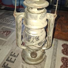 Beautiful Old Hurricane Lantern, Post Available, The lantern features a central glass globe protected by a metal cage, designed to shield the flame from wind while providing light