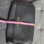 Michael Kors black crossbody bag with adjustable shoulder strap and gold-tone hardware. In great condition, only some colour fading on the logo, as shown in the photos. Image 8