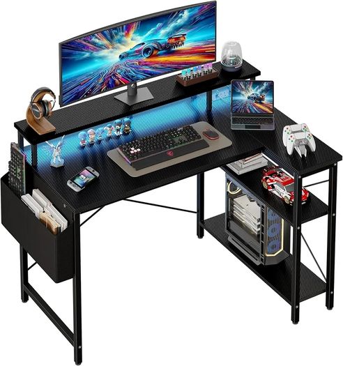 100cm Reversible L-Shaped Gaming Desk with Power Sockets & LED Lights, Carbon Fibre Computer Table with Long Monitor Stand, 2-Tier CPU Storage Shelves & Side Pouch, Black