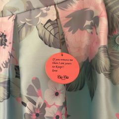 Chi Chi dress in size 16. New never worn . Pretty dress to wear on Weddings or any special occasion .