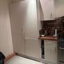 Fitted kitchen. Light cream high gloss kitchen Image 2