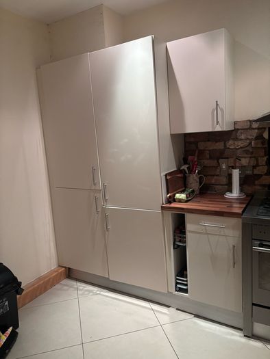 Fitted kitchen. Light cream high gloss kitchen
