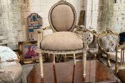Carved wood chair with sacking material