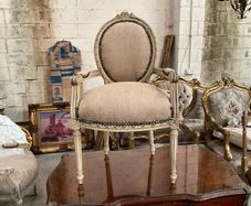 Carved wood chair with sacking material
