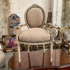 Carved wood chair with sacking material